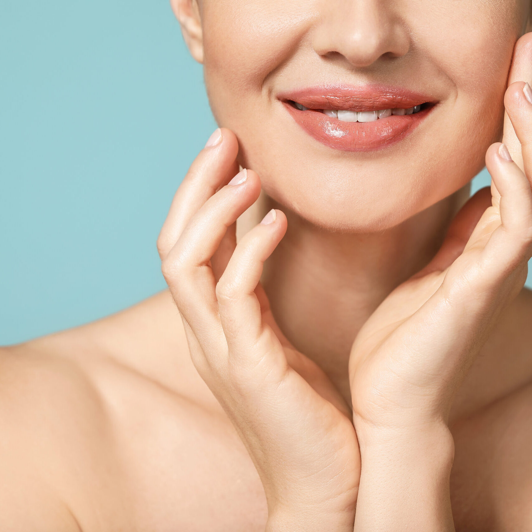 Beautiful young woman with healthy skin on color background, closeup